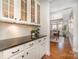 Elegant butlers pantry with custom cabinetry and granite countertops at 1806 Grayscroft Dr, Waxhaw, NC 28173