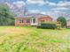 Expansive backyard with brick home, large windows, and a deck, perfect for outdoor entertaining and relaxation at 209 Chesterfield Canal None, Fort Mill, SC 29708