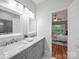 Bathroom with dual sinks, gray cabinetry, and a shower to the left at 209 Chesterfield Canal None, Fort Mill, SC 29708