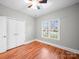 Neutral bedroom with hardwood floors, closet, ceiling fan, and window offering natural light at 209 Chesterfield Canal None, Fort Mill, SC 29708