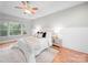 Cozy main bedroom boasts a ceiling fan, a plush rug, and natural lighting at 209 Chesterfield Canal None, Fort Mill, SC 29708