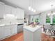 Well-lit kitchen with white cabinets, island, and updated appliances at 209 Chesterfield Canal None, Fort Mill, SC 29708