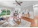 Open living room area featuring hardwood floors, fireplace, and natural light from sliding glass doors to deck at 209 Chesterfield Canal None, Fort Mill, SC 29708