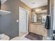 Bathroom with a large mirror and vanity at 210 N Church St # 2411, Charlotte, NC 28202