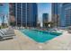 Stunning rooftop pool surrounded by lounge chairs, offering panoramic views of the city skyline at 210 N Church St # 2411, Charlotte, NC 28202