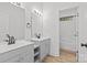 Stylish bathroom with double vanity, mirrors, and a walk-in shower at 2100 St Paul St, Charlotte, NC 28216