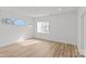 Bedroom with natural light, wood flooring, and modern light fixtures at 2100 St Paul St, Charlotte, NC 28216