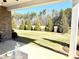 Private backyard with a grassy area and wooded backdrop at 21087 Cadence Trace Dr, Mint Hill, NC 28227