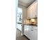 Butlers pantry with white shaker cabinets and marble backsplash at 21087 Cadence Trace Dr, Mint Hill, NC 28227