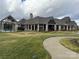 Community clubhouse with a covered patio and grilling area at 21087 Cadence Trace Dr, Mint Hill, NC 28227