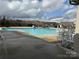 Community swimming pool with surrounding patio furniture at 21087 Cadence Trace Dr, Mint Hill, NC 28227