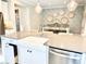 Kitchen island with farmhouse sink and dishwasher at 21087 Cadence Trace Dr, Mint Hill, NC 28227