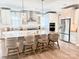 Bright kitchen features an eat-in island and stainless steel appliances at 21087 Cadence Trace Dr, Mint Hill, NC 28227