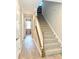 Elegant staircase with carpeted steps and white railing at 21087 Cadence Trace Dr, Mint Hill, NC 28227