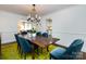 Spacious dining room with a large table and access to the kitchen and living room at 2121 Winter St, Charlotte, NC 28205