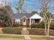 Charming brick house with a front yard, walkway, and covered porch at 2121 Winter St, Charlotte, NC 28205