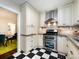 Modern kitchen featuring stainless steel appliances and checkerboard floors at 2121 Winter St, Charlotte, NC 28205