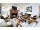 Living room featuring hardwood floors, a fireplace, and comfortable seating at 2121 Winter St, Charlotte, NC 28205