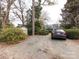 Gravel parking area with shed and mature trees at 2121 Winter St, Charlotte, NC 28205