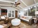 Relaxing screened porch with wicker furniture, a ceiling fan and flagstone flooring at 2121 Winter St, Charlotte, NC 28205