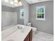 Bathroom with double vanity and updated flooring at 2139 Mallard Green Pl, Charlotte, NC 28262