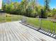 Spacious deck overlooking a fenced backyard with wooded area at 2139 Mallard Green Pl, Charlotte, NC 28262