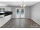 Dining room with hardwood floors and French doors leading to the backyard at 2139 Mallard Green Pl, Charlotte, NC 28262