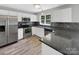 Modern kitchen with stainless steel appliances and granite countertops at 2139 Mallard Green Pl, Charlotte, NC 28262