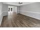 Bright living room with hardwood floors and an open floor plan at 2139 Mallard Green Pl, Charlotte, NC 28262