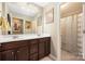 Bathroom featuring a double sink vanity with dark wood cabinets and a shower with patterned curtain at 223 Blossom Ridge Dr # 137, Mooresville, NC 28117