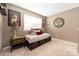 Bedroom with a cushioned bench and storage, a bedside table, and a window with blinds at 223 Blossom Ridge Dr # 137, Mooresville, NC 28117