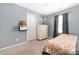 Bedroom featuring a neutral color palette, a window with curtains and a dresser at 223 Blossom Ridge Dr # 137, Mooresville, NC 28117