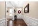 Inviting foyer featuring hardwood floors and elegant wainscoting at 223 Blossom Ridge Dr # 137, Mooresville, NC 28117