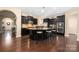 Spacious kitchen showcasing dark cabinetry, granite counters, and stainless appliances at 223 Blossom Ridge Dr # 137, Mooresville, NC 28117