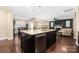 Kitchen island with stainless steel dishwasher, sink, and open concept floorplan at 223 Blossom Ridge Dr # 137, Mooresville, NC 28117