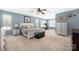 Spacious main bedroom with tray ceilings, carpet, and large windows at 223 Blossom Ridge Dr # 137, Mooresville, NC 28117