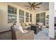 Cozy covered patio with comfortable seating and a stylish fan, ideal for entertaining outdoors at 223 Blossom Ridge Dr # 137, Mooresville, NC 28117