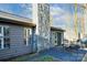 Outdoor patio featuring a stone chimney, table with chairs, grill and slider door at 2710 Redbud Ln, Fort Mill, SC 29715