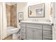 Updated bathroom with a gray vanity, tiled shower, and modern fixtures at 2710 Redbud Ln, Fort Mill, SC 29715