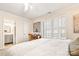 Bedroom featuring plantation shutters, carpet and ensuite bathroom at 2710 Redbud Ln, Fort Mill, SC 29715