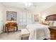 Bright bedroom with a large window, shutters, carpet, and a wooden desk with chair at 2710 Redbud Ln, Fort Mill, SC 29715