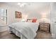 Comfortable bedroom with soft lighting, cozy bedding, and a view through the window at 2710 Redbud Ln, Fort Mill, SC 29715