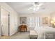 Spacious bedroom with desk, artwork, a bright window with shutters, and neutral tones at 2710 Redbud Ln, Fort Mill, SC 29715