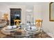 Dining area with a glass table set for four and a hutch at 2710 Redbud Ln, Fort Mill, SC 29715