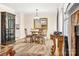 Cozy dining area with a chandelier, dark wood accents, and hardwood floors at 2710 Redbud Ln, Fort Mill, SC 29715