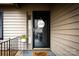 Inviting front entrance with a decorative 'welcome' wreath and flower decor at 2710 Redbud Ln, Fort Mill, SC 29715