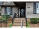 Charming home entrance with brick steps, black shutters, and a welcoming front door at 2710 Redbud Ln, Fort Mill, SC 29715