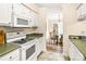 Kitchen with white appliances and adjacent dining area at 2710 Redbud Ln, Fort Mill, SC 29715