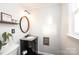 Bathroom featuring granite counters, decorative oval mirror and natural light at 2745 33Rd Ne Ave, Hickory, NC 28601