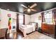 Bedroom featuring hardwood floors, ceiling fan, and a disco ball at 2745 33Rd Ne Ave, Hickory, NC 28601